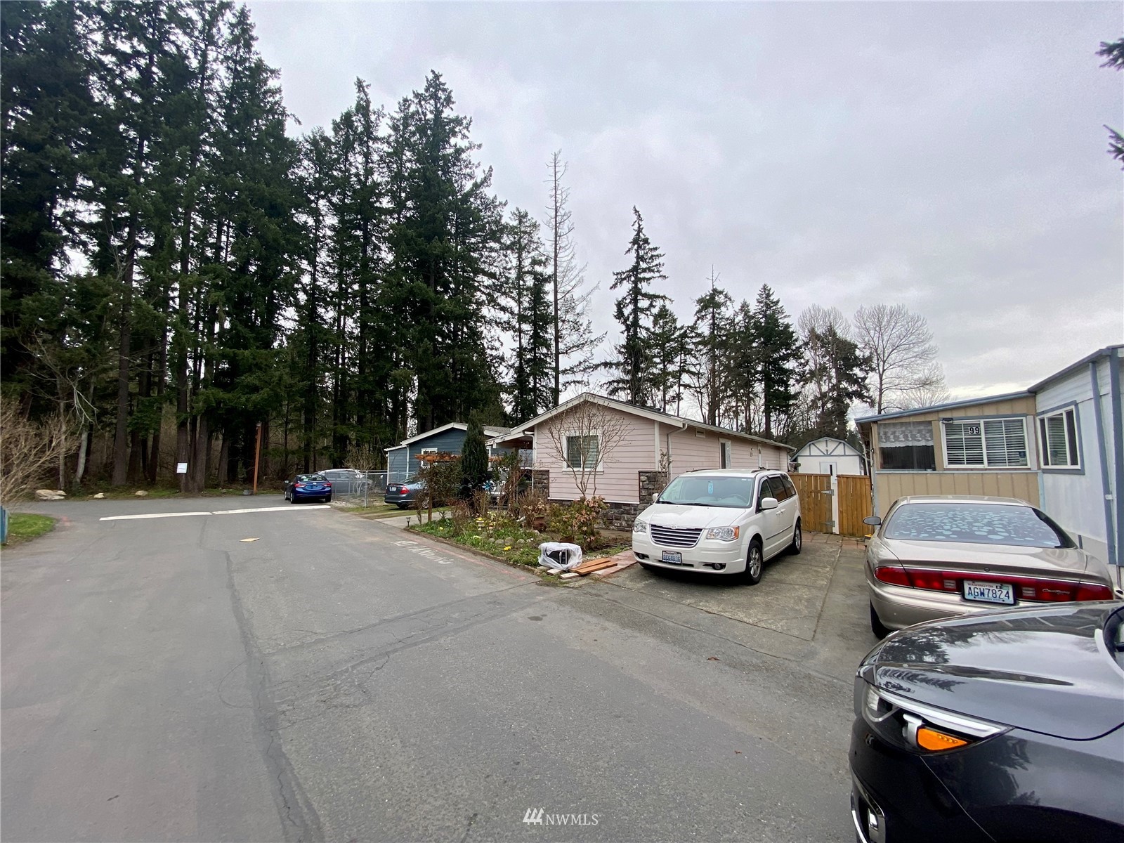 15232 Southeast 272nd Street, Unit 99 Kent, WA 98042 - Photo 15 of 15 a car parked in front of a house