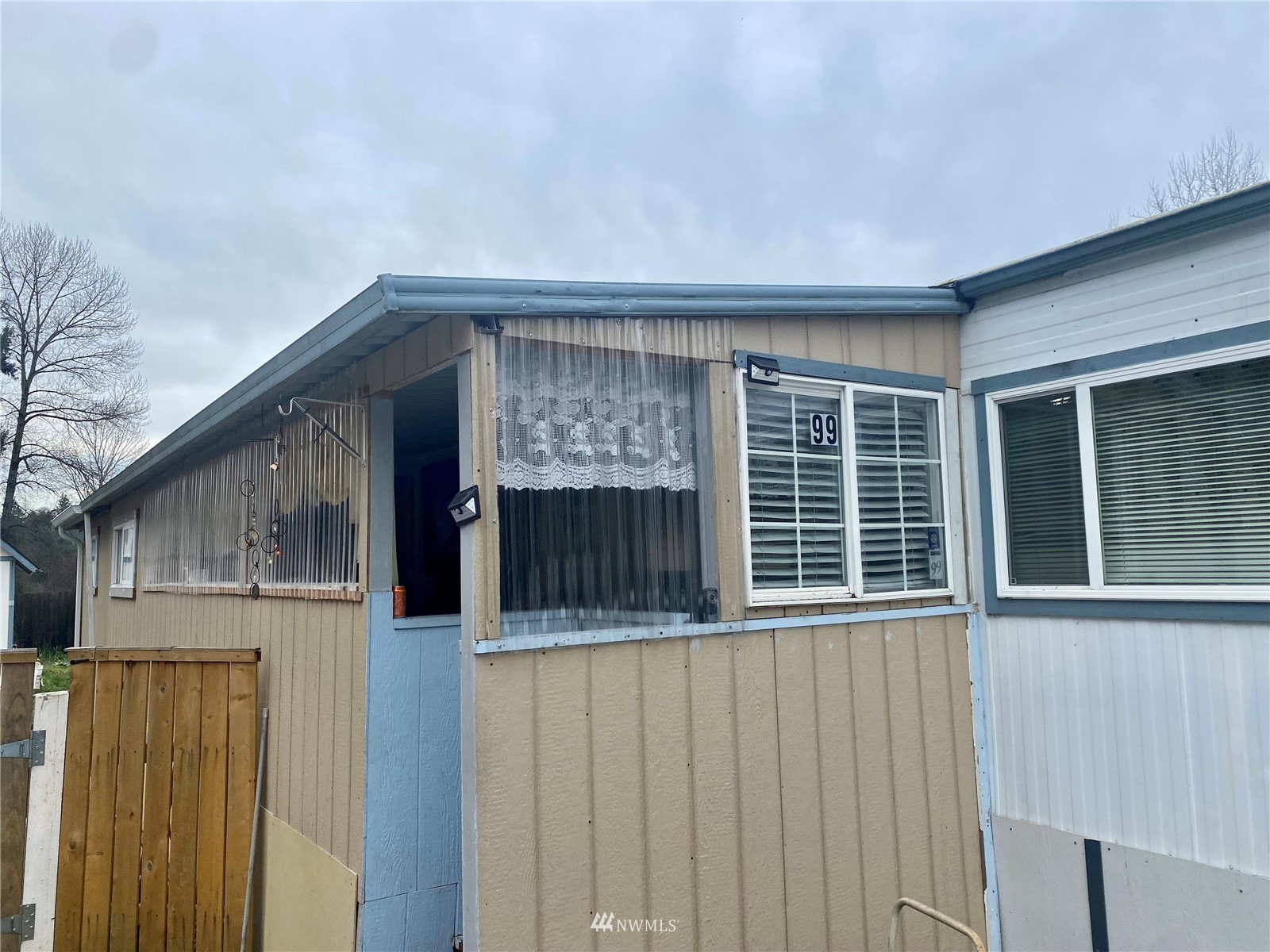 15232 Southeast 272nd Street, Unit 99 Kent, WA 98042 - Photo 2 of 15 a view of an house with a large window