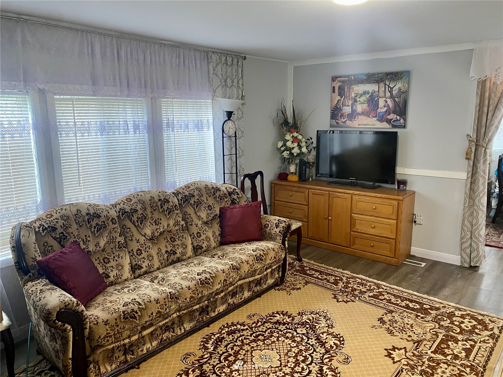 15232 Southeast 272nd Street, Unit 99 Kent, WA 98042 - Photo 4 of 15 a living room with furniture and a flat screen tv