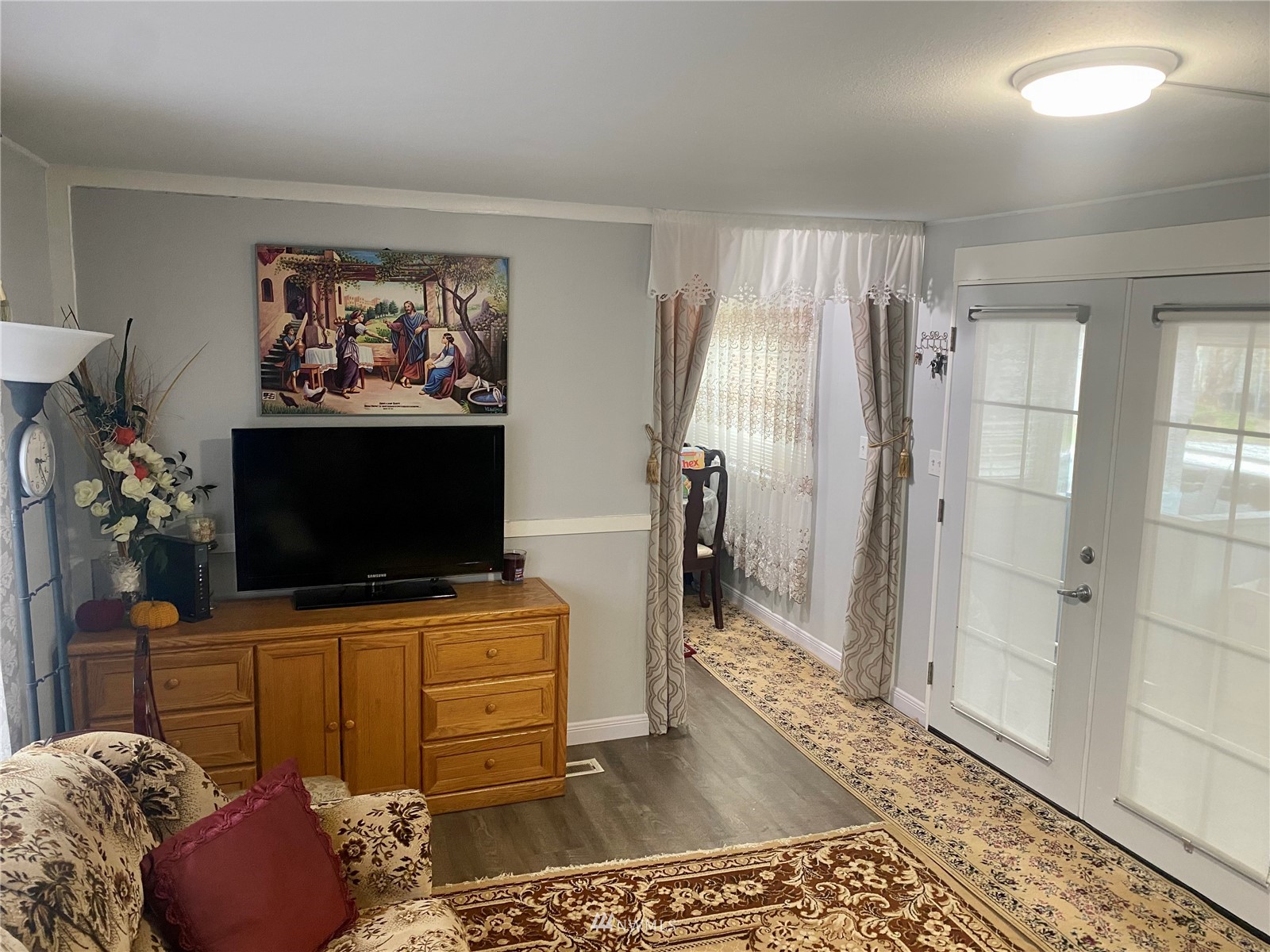 15232 Southeast 272nd Street, Unit 99 Kent, WA 98042 - Photo 6 of 15 a living room with furniture and a flat screen tv