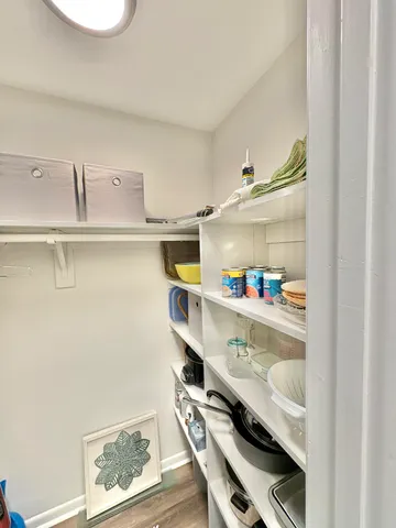 a view of a kitchen with a stove and a refrigerator