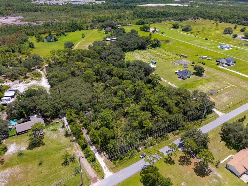 2521 Absher Road St. Cloud, FL 34771 - Photo 6 of 18 a view of a lake with a yard