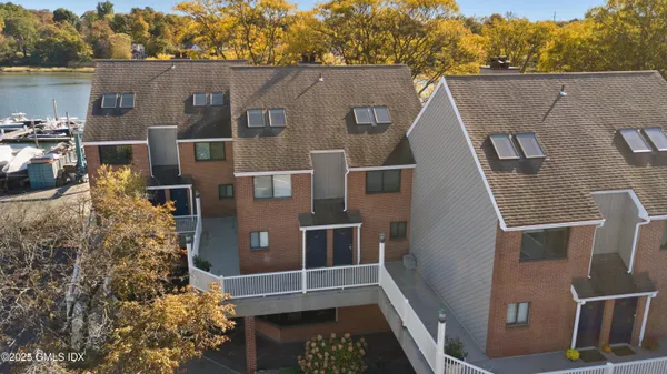 a aerial view of a house with a yard