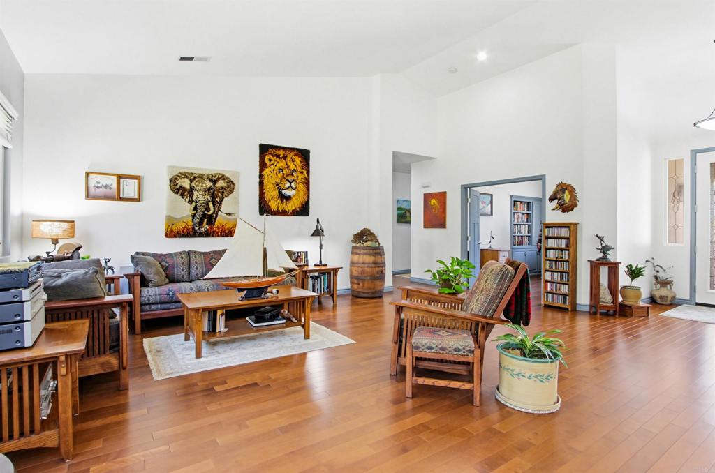 2194 Stone Castle Fallbrook, CA 92028 - Photo 14 of 60 a living room with furniture and wooden floor