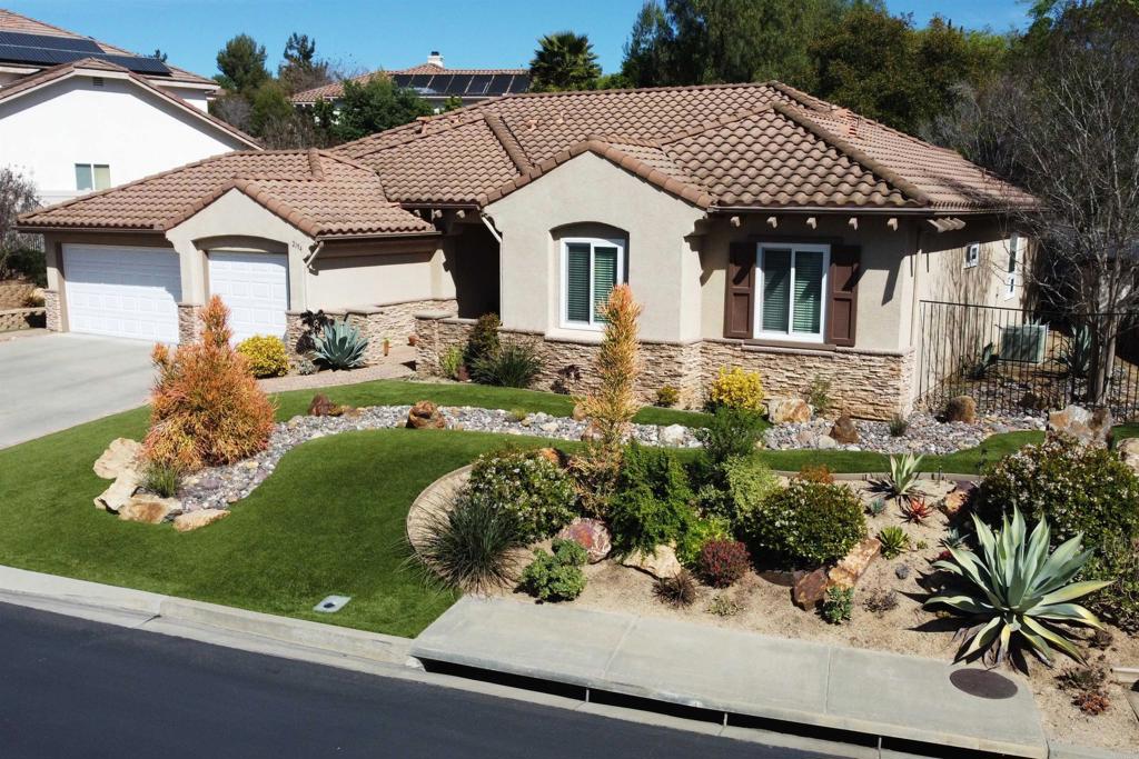 2194 Stone Castle Fallbrook, CA 92028 - Photo 2 of 60 a front view of a house with garden