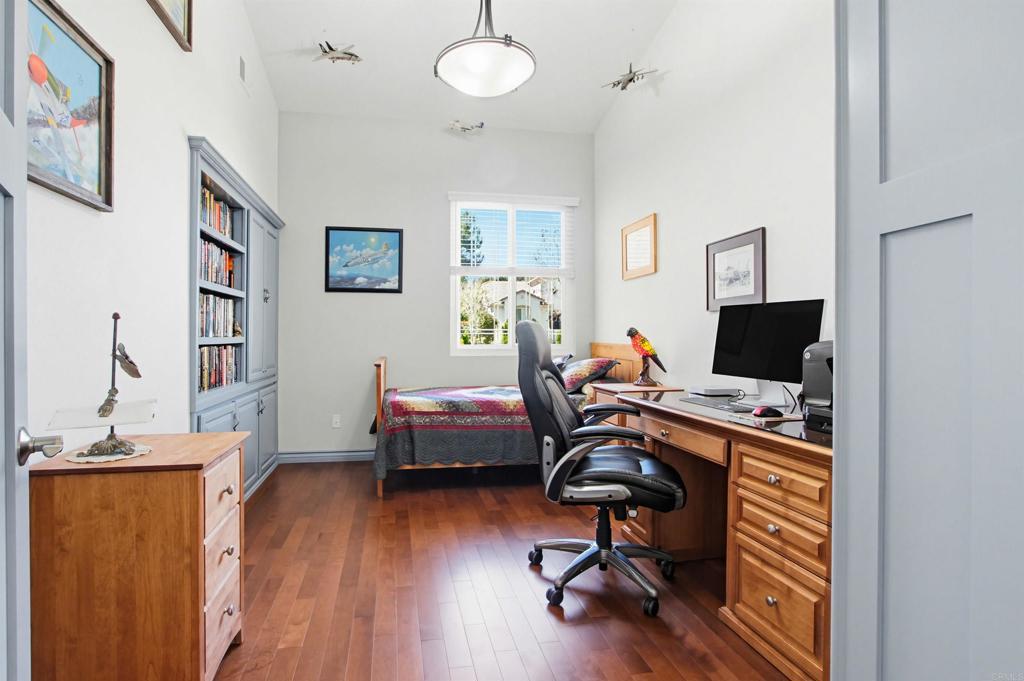 2194 Stone Castle Fallbrook, CA 92028 - Photo 24 of 60 a view of a workspace with furniture and a bedroom
