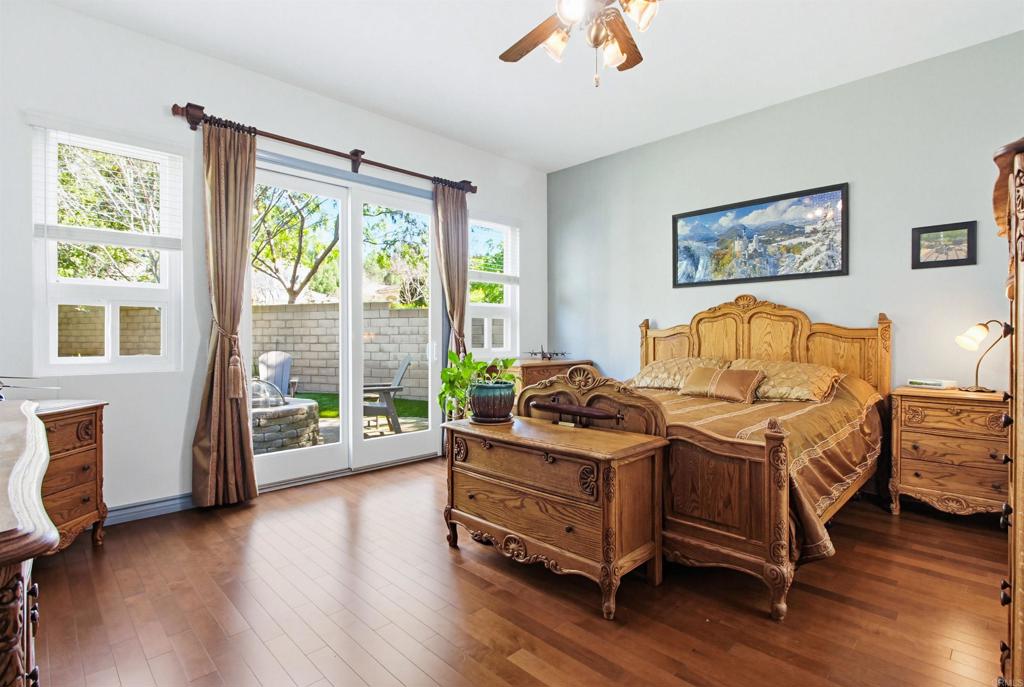 2194 Stone Castle Fallbrook, CA 92028 - Photo 26 of 60 a bedroom with bed and wooden floor