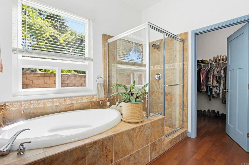 2194 Stone Castle Fallbrook, CA 92028 - Photo 31 of 60 a spacious bathroom with a granite countertop tub and a window