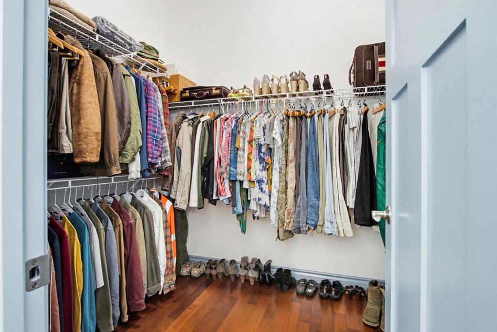 2194 Stone Castle Fallbrook, CA 92028 - Photo 33 of 60 a view of walk in closet with clothes and shoes