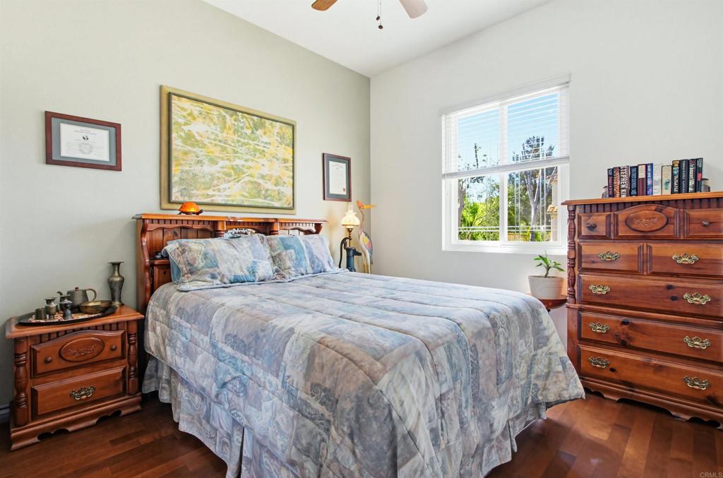 2194 Stone Castle Fallbrook, CA 92028 - Photo 34 of 60 a bedroom with a bed and a dresser