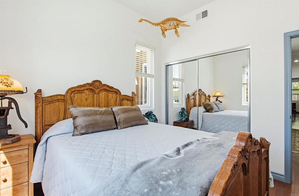2194 Stone Castle Fallbrook, CA 92028 - Photo 37 of 60 a bedroom with a bed and dresser