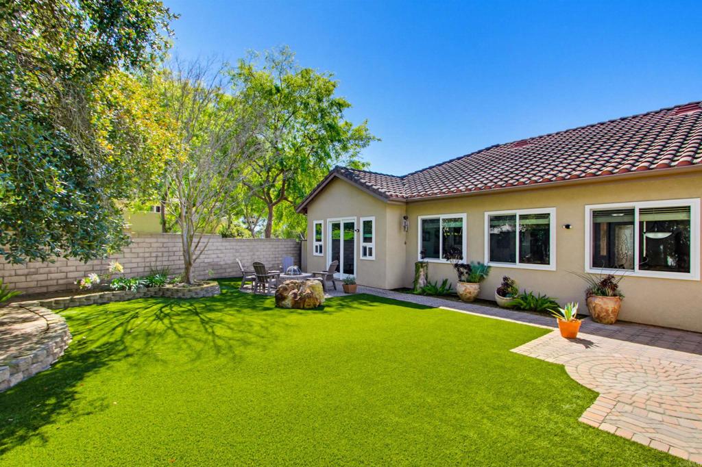 2194 Stone Castle Fallbrook, CA 92028 - Photo 45 of 60 a view of a house with a patio and a yard