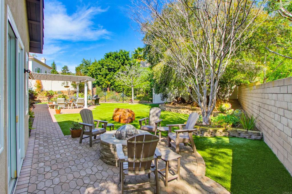 2194 Stone Castle Fallbrook, CA 92028 - Photo 49 of 60 a view of an chairs and table in the backyard
