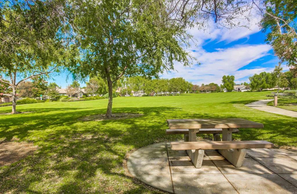 2194 Stone Castle Fallbrook, CA 92028 - Photo 57 of 60 a view of a big yard with table and chairs under an umbrella