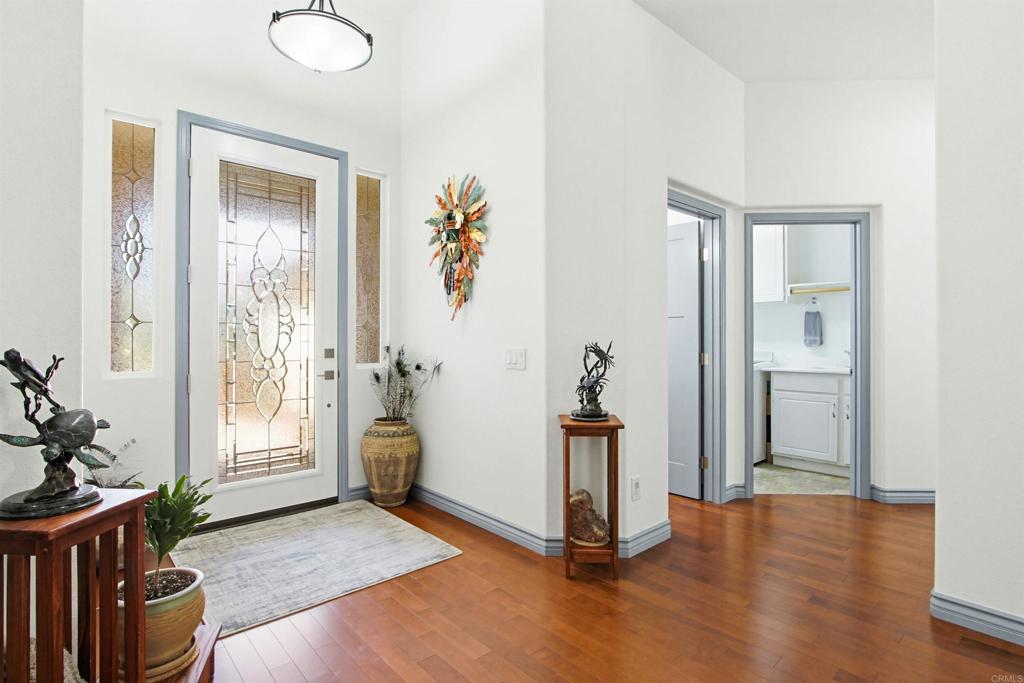 2194 Stone Castle Fallbrook, CA 92028 - Photo 9 of 60 a view of an entryway with wooden floor
