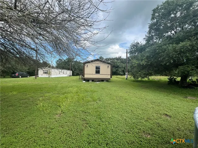 a house view with a garden space