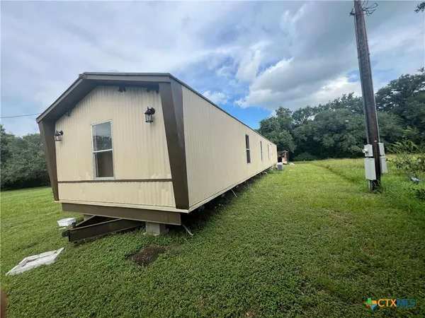 a house view with a backyard space