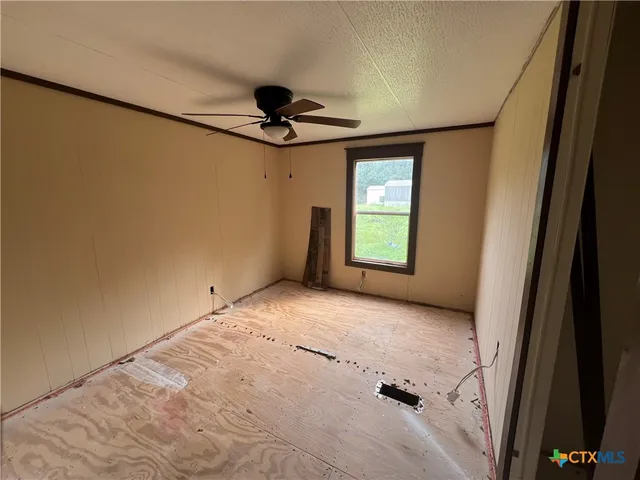 a view of empty room with windows