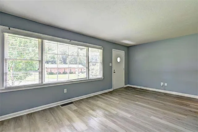 a view of an empty room with a window