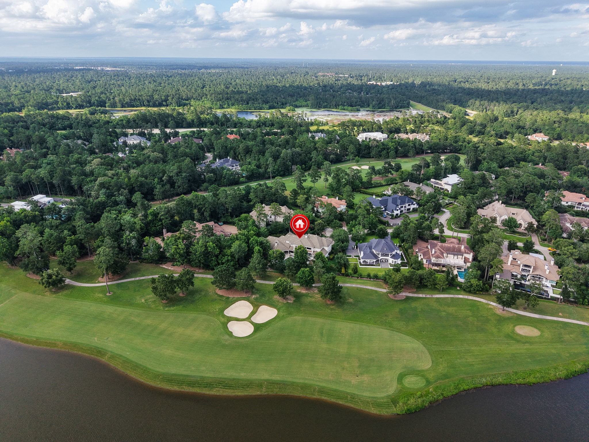 39 Maymont Way Spring, TX 77382 - Photo 48 of 50 This aerial photo showcases a beautiful home located near a golf course, surrounded by lush greenery and upscale residences. The property offers scenic views and a serene environment, ideal for golf enthusiasts and nature lovers.