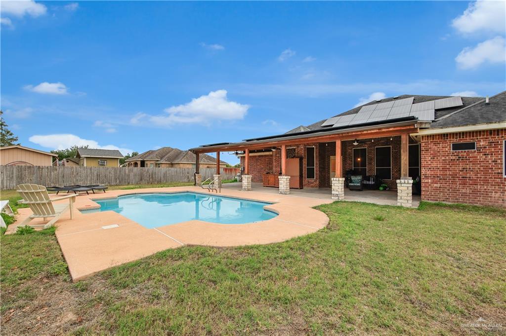 2005 Stuart Road Weslaco, TX 78599 - Photo 10 of 30 a view of a house with swimming pool and a yard
