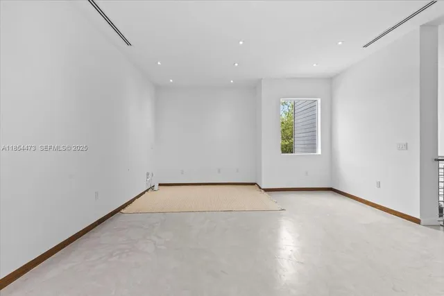 an empty room with windows