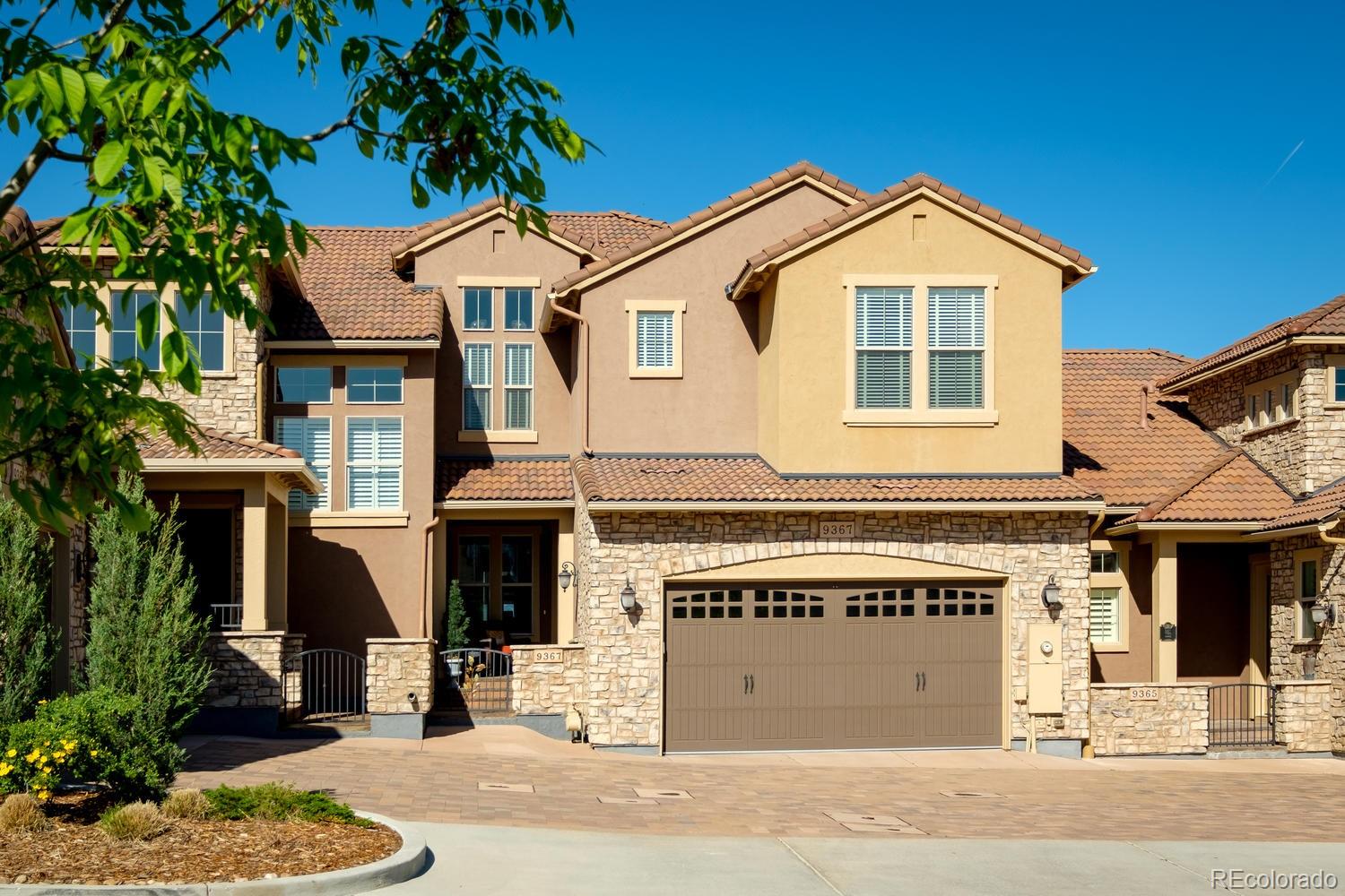 9367 Viaggio Way Highlands Ranch, CO 80126 - Photo 2 of 9 a front view of a house with a yard