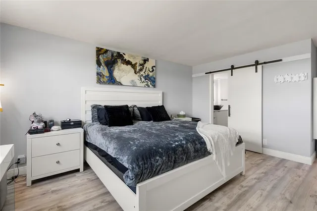 a bedroom with a bed and dresser