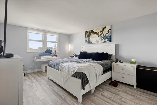 a bedroom with a bed and dresser