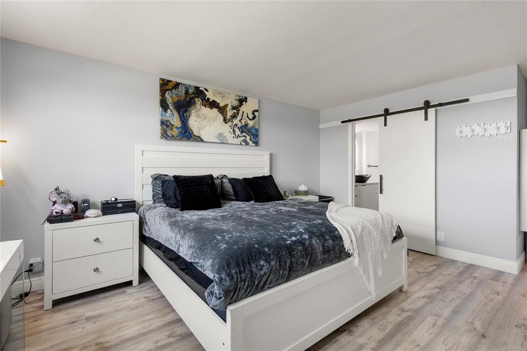 5500 Northwest 2nd Avenue, Unit 316 Boca Raton, FL 33487 - Photo 15 of 31 a bedroom with a bed and dresser