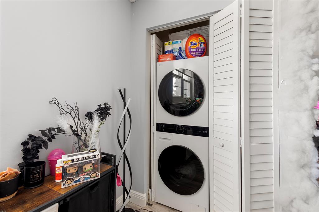 5500 Northwest 2nd Avenue, Unit 316 Boca Raton, FL 33487 - Photo 21 of 31 a utility room with dryer and washer