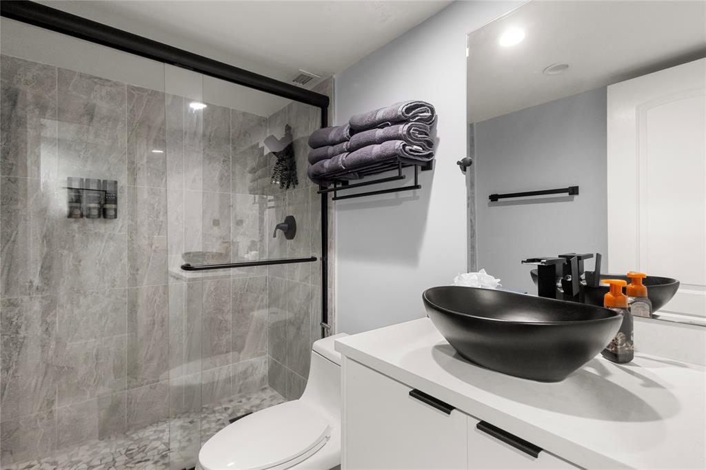 5500 Northwest 2nd Avenue, Unit 316 Boca Raton, FL 33487 - Photo 22 of 31 a bathroom with a sink toilet and shower