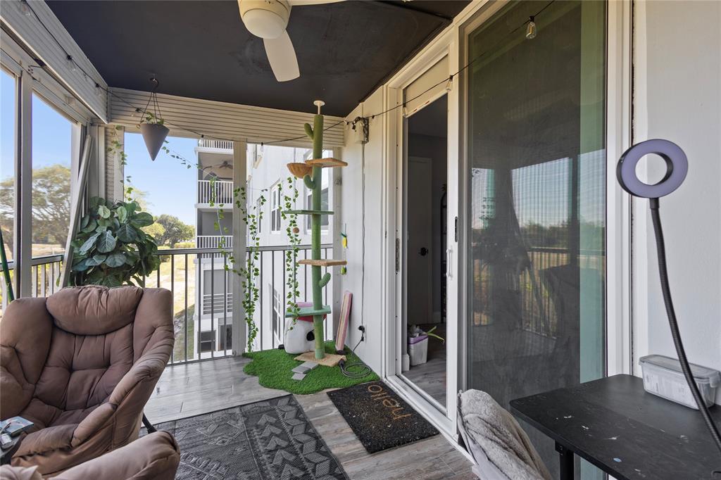 5500 Northwest 2nd Avenue, Unit 316 Boca Raton, FL 33487 - Photo 26 of 31 a living room with furniture and a floor to ceiling window