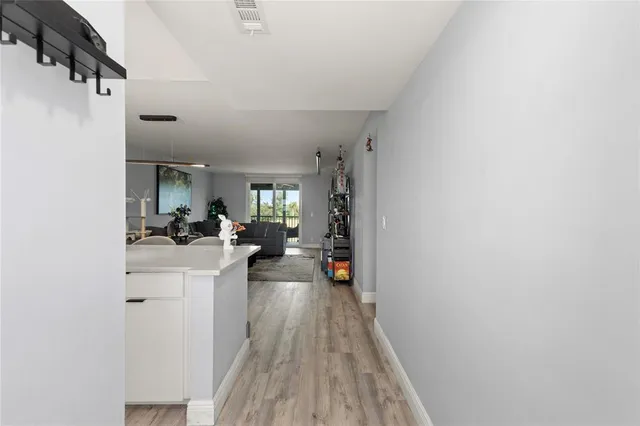 a view of living room with furniture and wooden floor