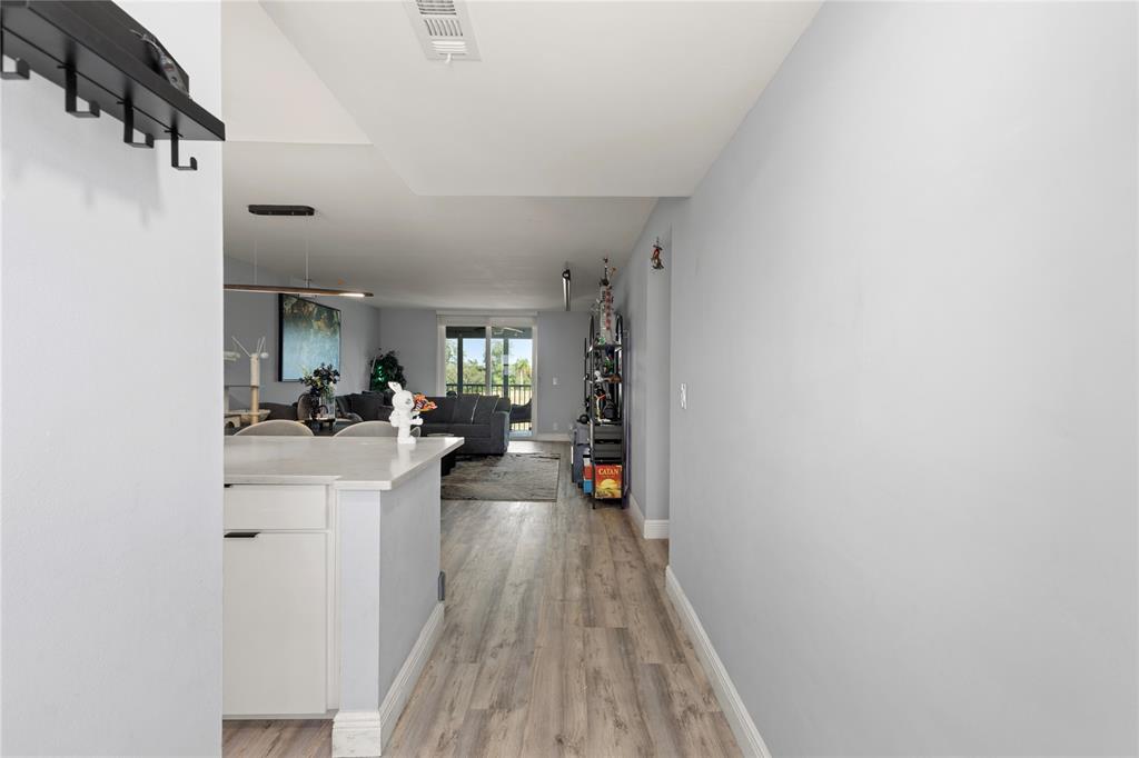 5500 Northwest 2nd Avenue, Unit 316 Boca Raton, FL 33487 - Photo 4 of 31 a view of living room with furniture and wooden floor