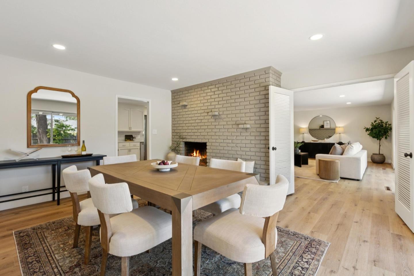 755 Santa Rita Avenue Los Altos, CA 94022 - Photo 13 of 50 a view of a dining room with furniture and a fireplace