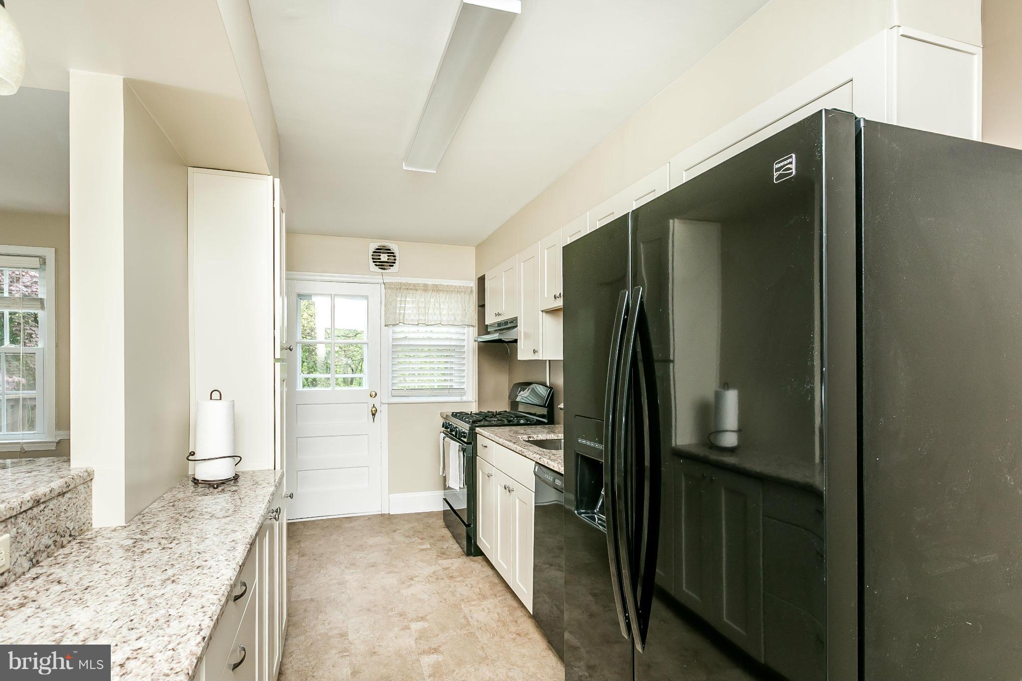 120 Stanmore Road Baltimore, MD 21212 - Photo 11 of 27 a kitchen with a refrigerator and a sink