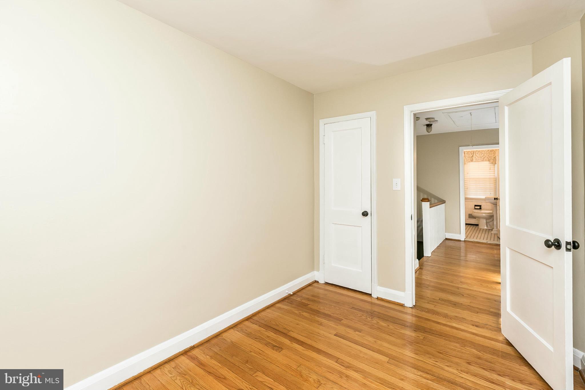 120 Stanmore Road Baltimore, MD 21212 - Photo 16 of 27 a view of a room with wooden floor and a bathroom