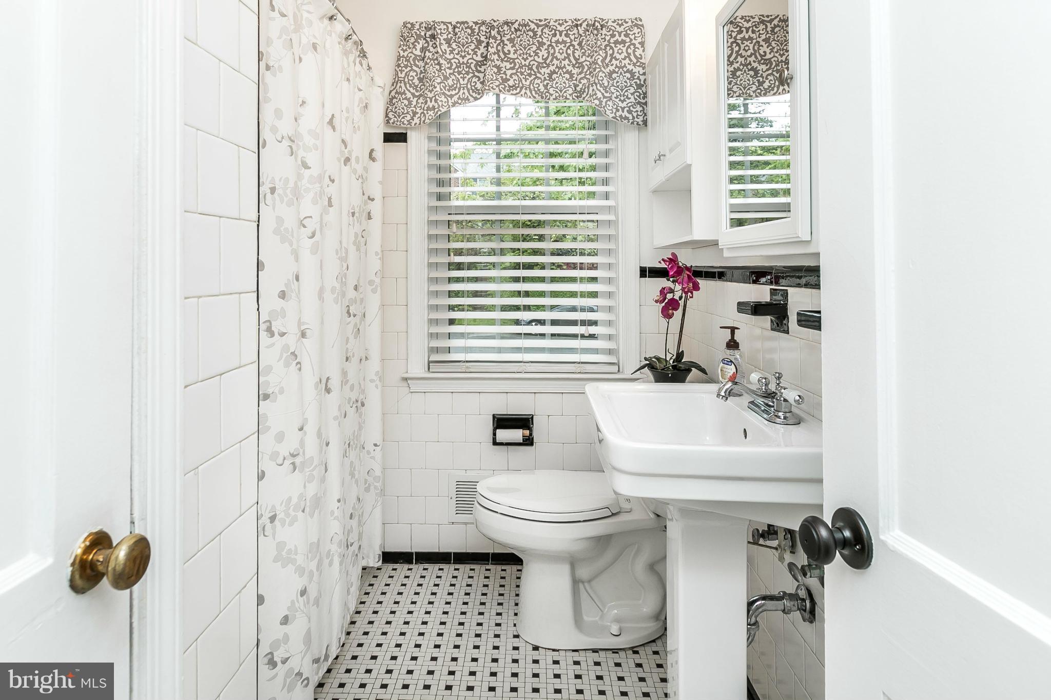 120 Stanmore Road Baltimore, MD 21212 - Photo 17 of 27 a bathroom with a sink toilet and shower
