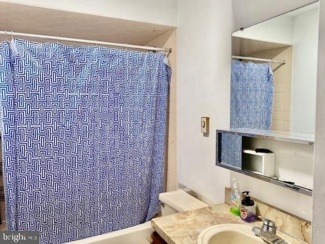 66 Low Street Delano, PA 17948 - Photo 14 of 21 a bathroom with a sink a toilet and shower curtain