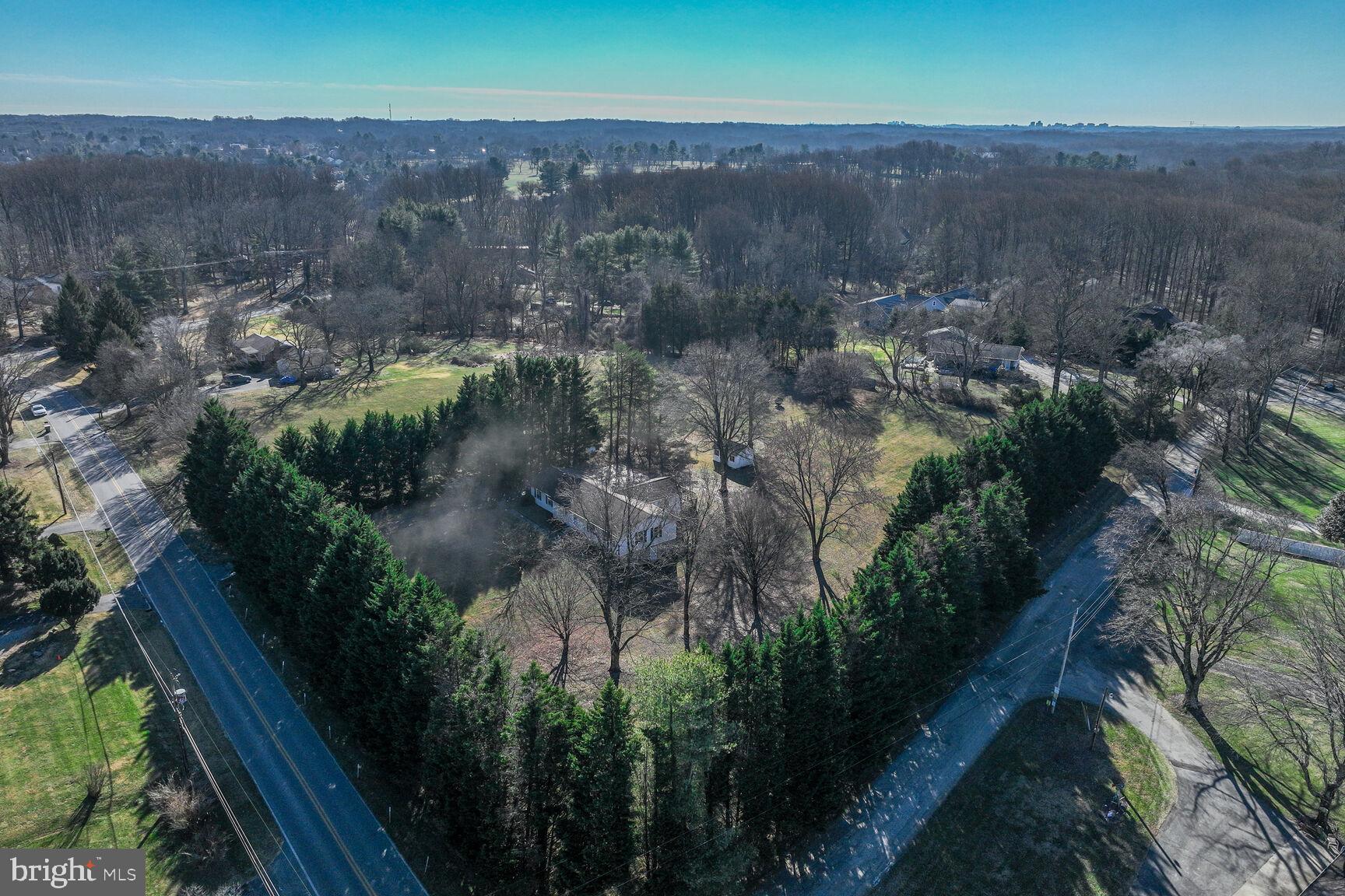 4706 Bready Road Rockville, MD 20853 - Photo 2 of 25 an aerial view of a house with a yard