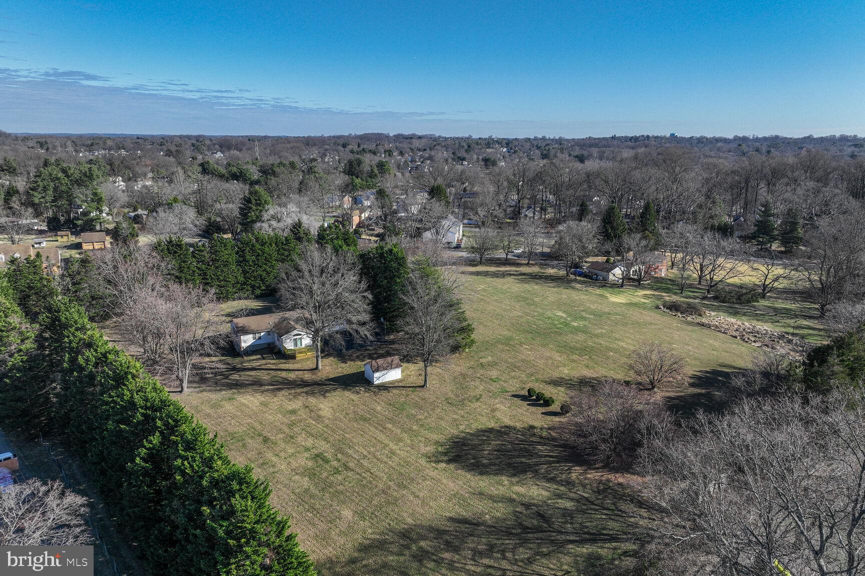 4706 Bready Road Rockville, MD 20853 - Photo 3 of 25 a view of a lake with a mountain in the back
