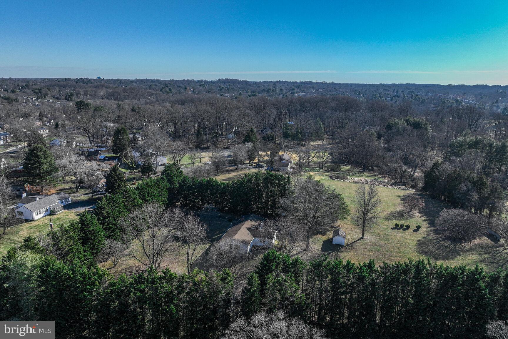 4706 Bready Road Rockville, MD 20853 - Photo 5 of 25 an aerial view of a house with a yard