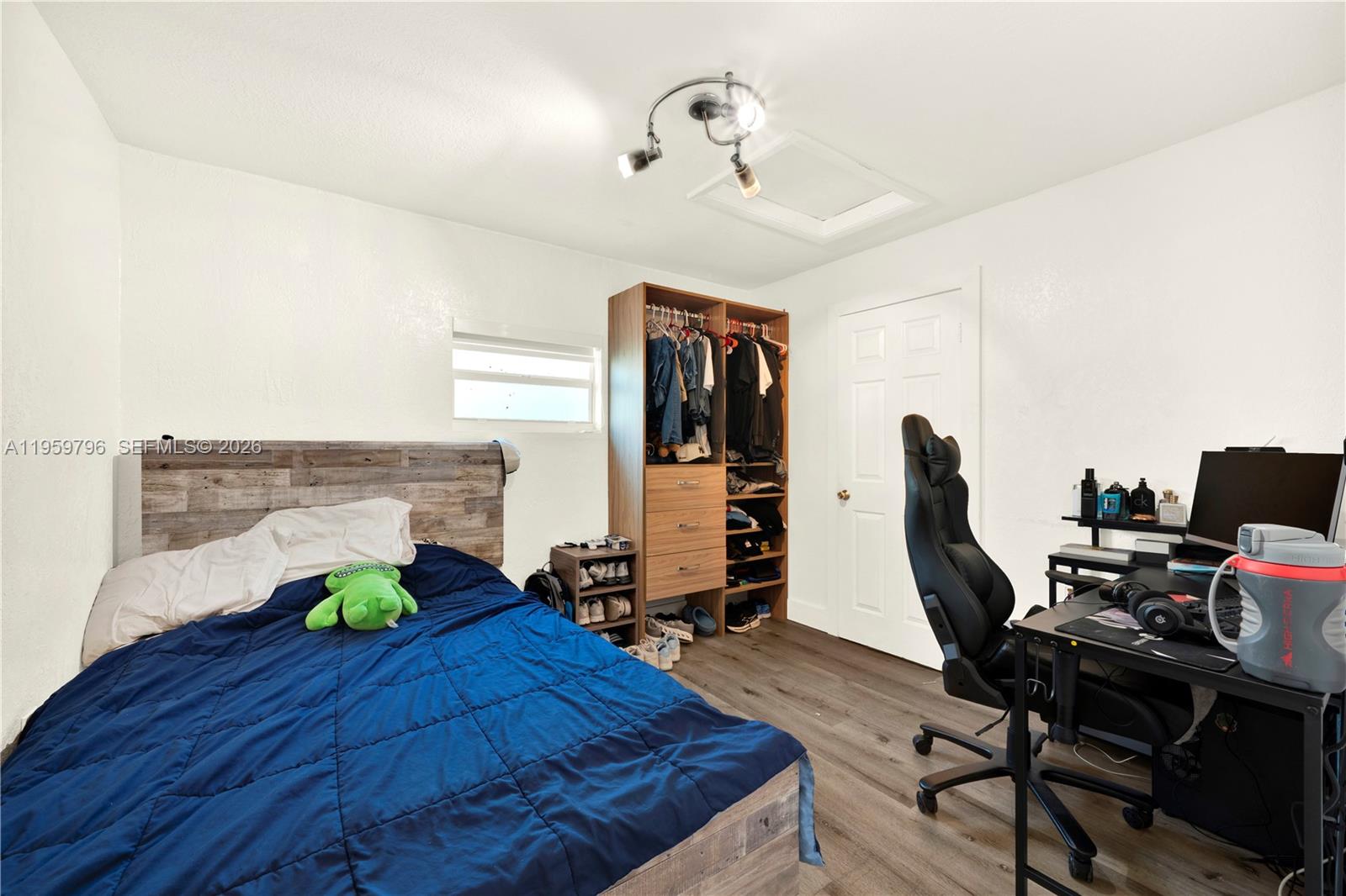 14600 Southwest 124th Place Miami, FL 33186 - Photo 15 of 34 a bed room with a bed and a desk