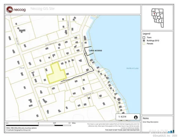 a view of a street with wooden fence