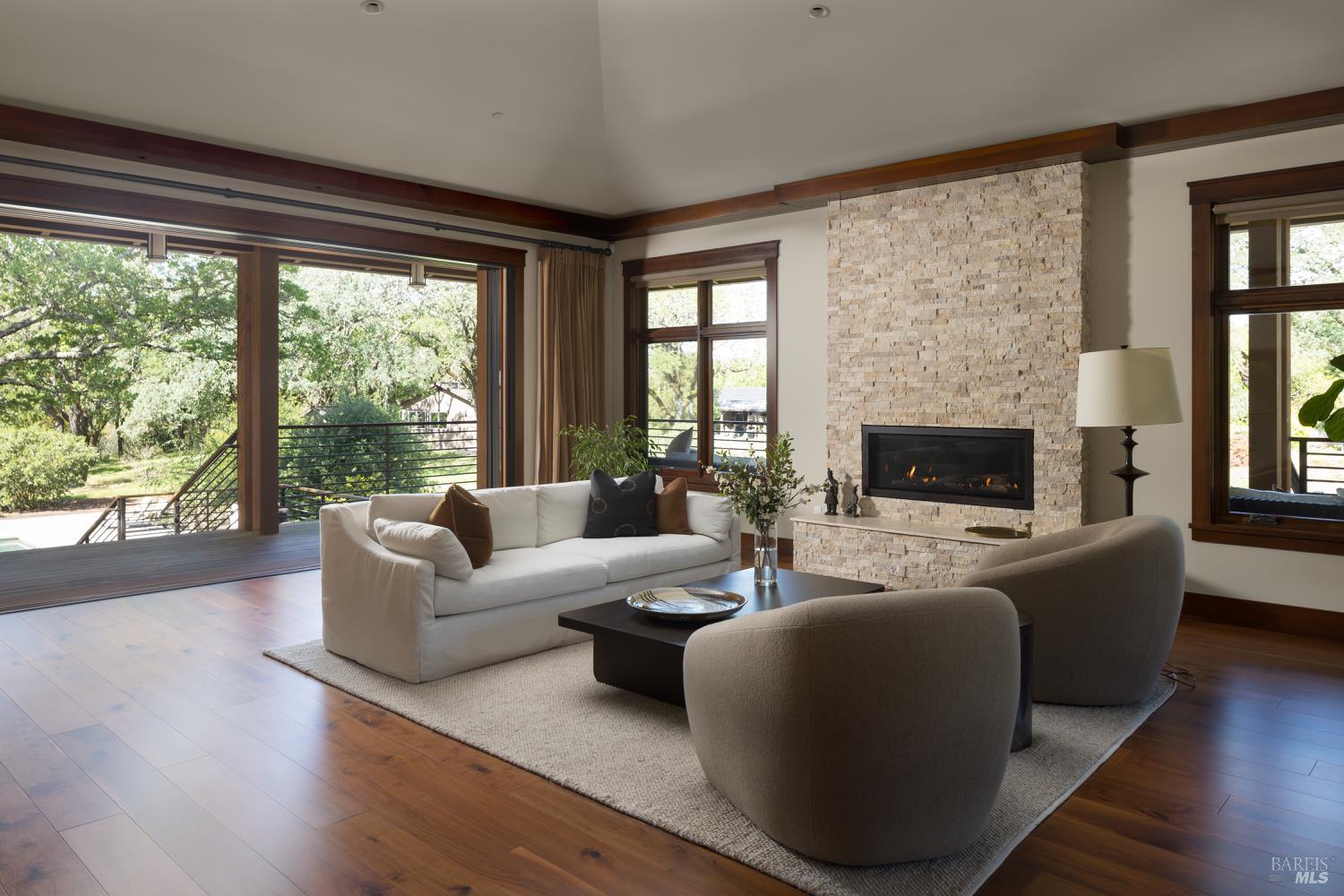 3525 Wood Valley Road Sonoma, CA 95476 - Photo 17 of 39 a living room with furniture a fireplace and a large window
