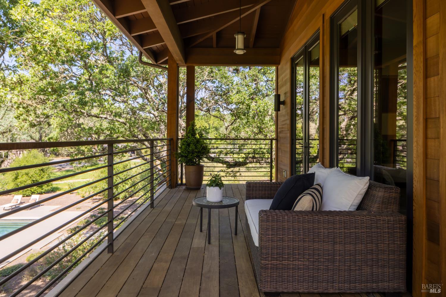 3525 Wood Valley Road Sonoma, CA 95476 - Photo 25 of 39 a balcony with wooden floor and furniture