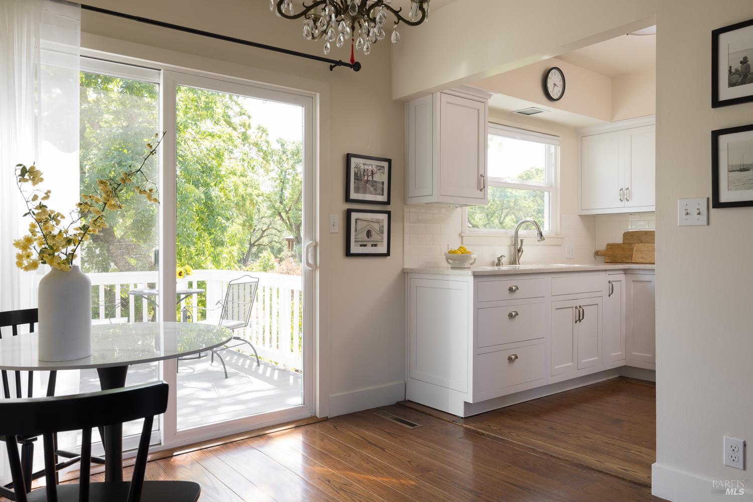 3525 Wood Valley Road Sonoma, CA 95476 - Photo 31 of 39 a view of a dining room with furniture window and wooden floor