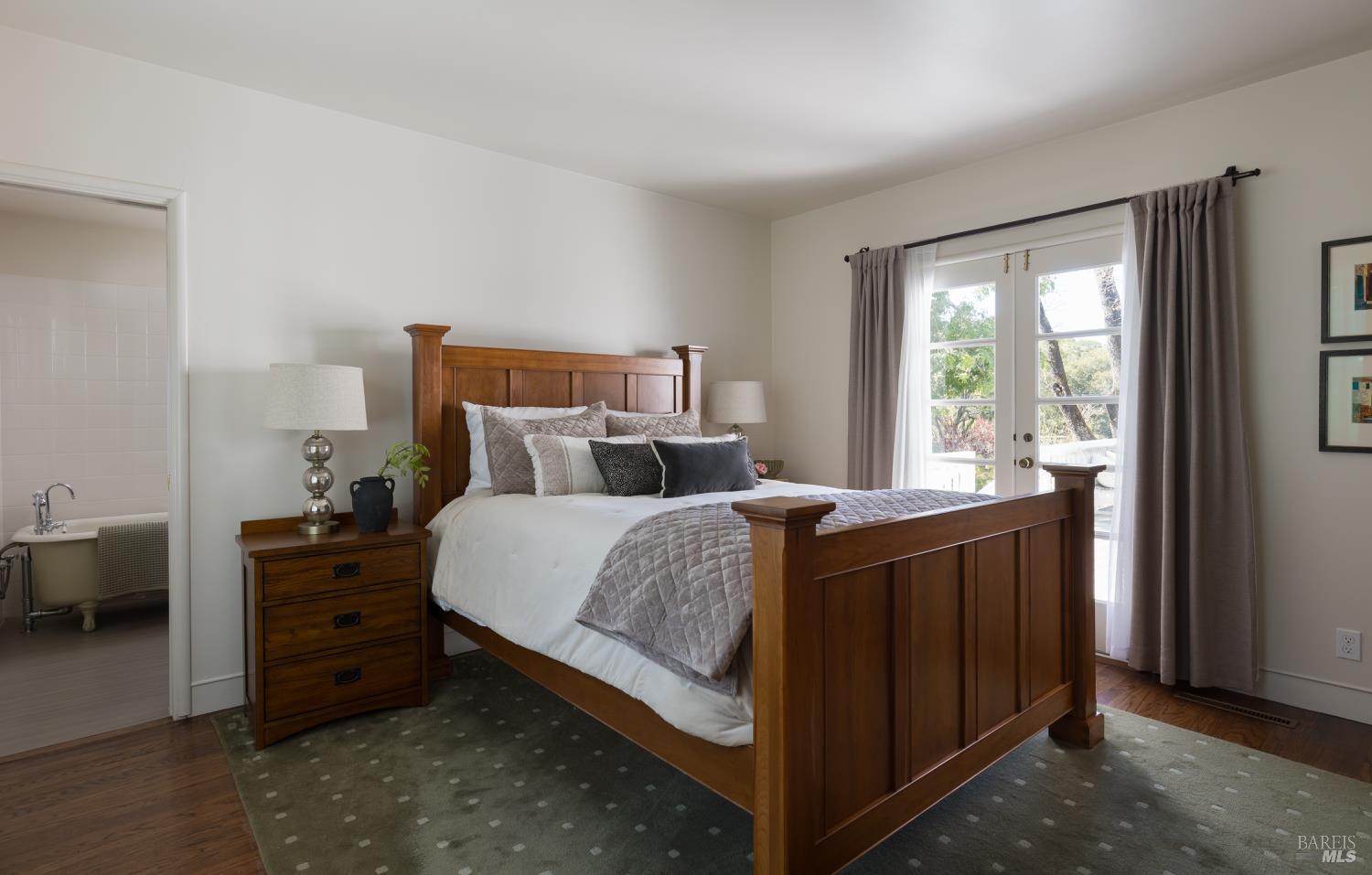 3525 Wood Valley Road Sonoma, CA 95476 - Photo 35 of 39 a bedroom with a bed and a dresser next to a window