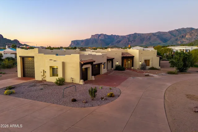 a view of a house with a mountain in front of it